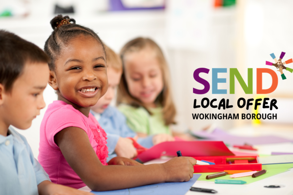 Four children sat a table smiling