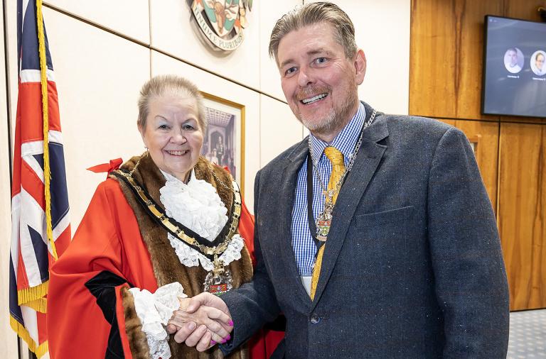 New Wokingham Borough Mayor Cllr Beth Rowland shakes hands with new Deputy Mayor Cllr Adrian Mather