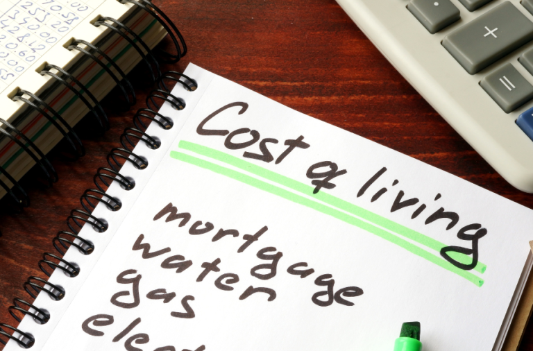 Cost of living notebook that says mortgage, water, gas and electricity
