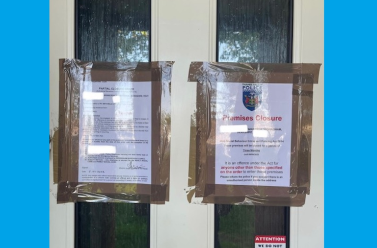 Eviction notices on a door where suspected drug dealers were removed from a property