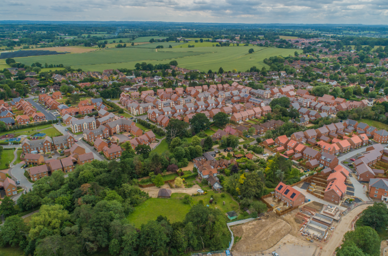 An aerial shot of new housing and green space in Wokingham Borough