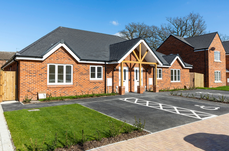 The entrance, parking and front garden at new specialist adult social care housing