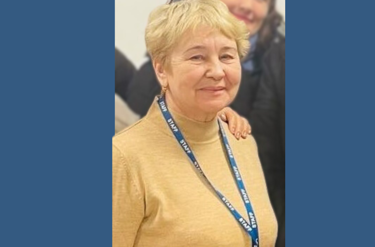 Nina from Ukraine smiles into the camera