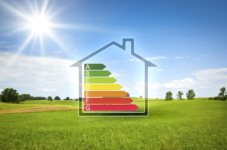 sunny day in a field with an energy performance certificate inside an outline of a house