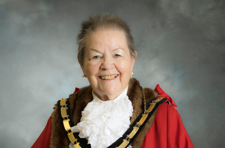 Official headshot of Wokingham Borough Mayor Cllr Beth Rowland in official regalia including robes and chain of office