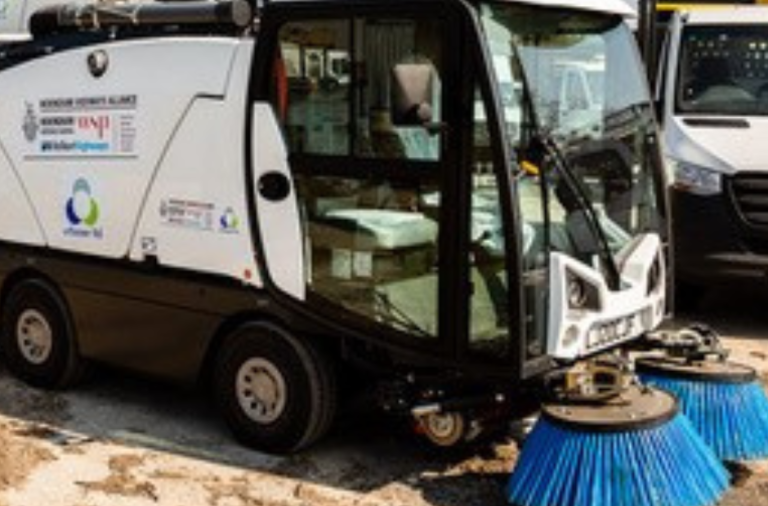 Street sweeping vehicle with Wokingham Borough Council and partner logos on the side