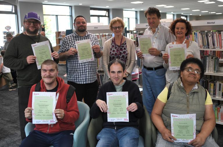 Members of CLASP holding their certificates at Wokingham Library