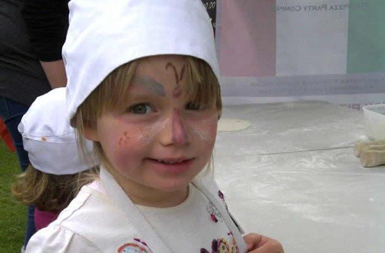 A child dressed like a chef