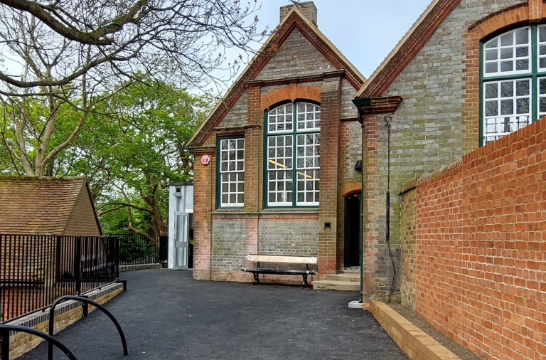 Courtyard outside the new Twyford Library entrance with seating and bicycle racks