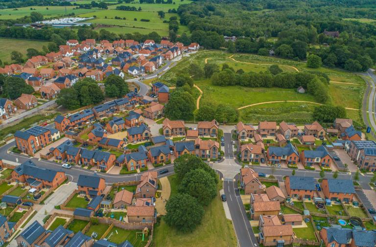Aerial view of several closes filled with modern houses and attractive landscaping