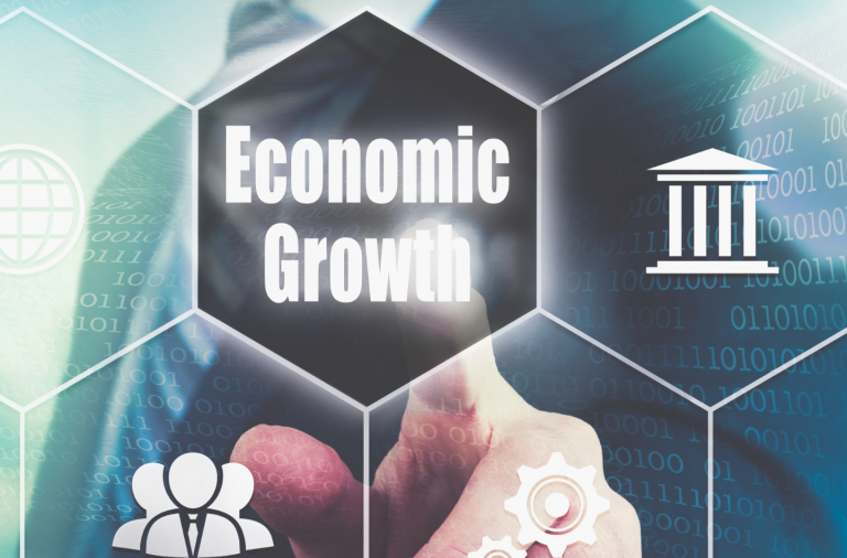 A conceptual image: a man in the background with a finger pointing to the text that reads Economic Growth