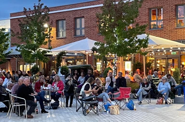 People sitting out in an outdoor space