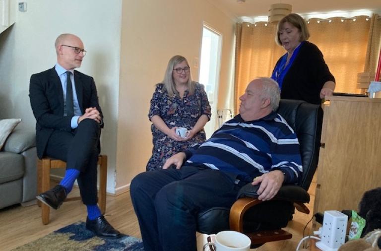 Care Minister talking with a local resident at a visit to Wokingham care home