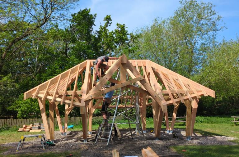 Wooden shelter under construction as part of Forest of Imagination