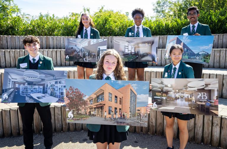 Children at Bohunt Wokingham holding illustrations of the new sixth form