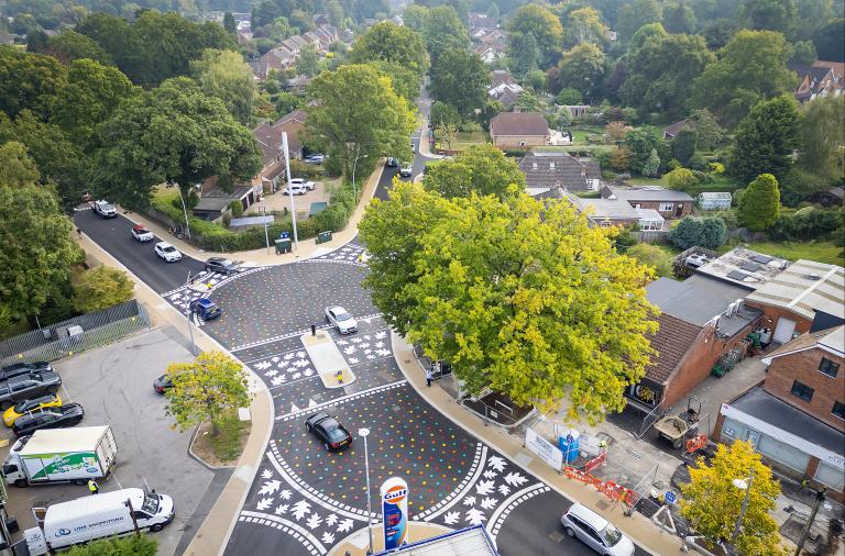 Aerial view of the new California Crossroads junction with level surface and multi-coloured leaf patterns painted on the carriageway