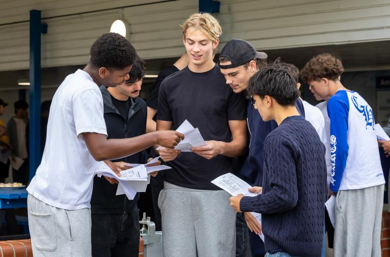 GCSE students looking at their results