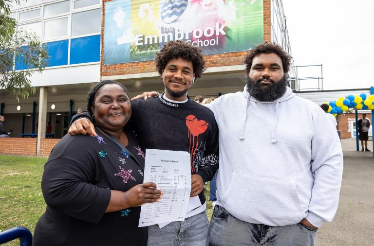 GCSE students with their results