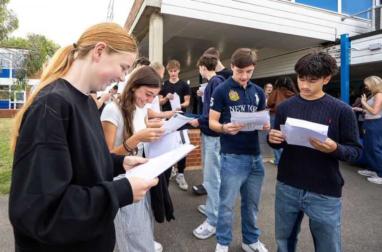 GCSE students looking at their results