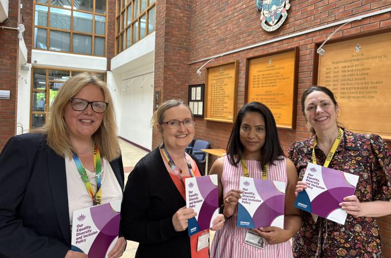 Council colleagues with new EDI Policy handbook