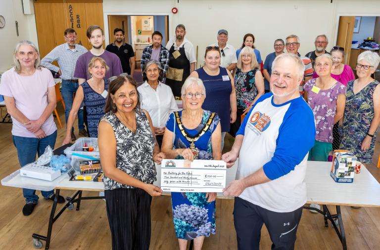 (L-R) Billie Bacha (Chair of Lambs Lane Repair Café), The Mayor and Jason McMahon (Building for the Future- Fundraising Manager) accepting a cheque