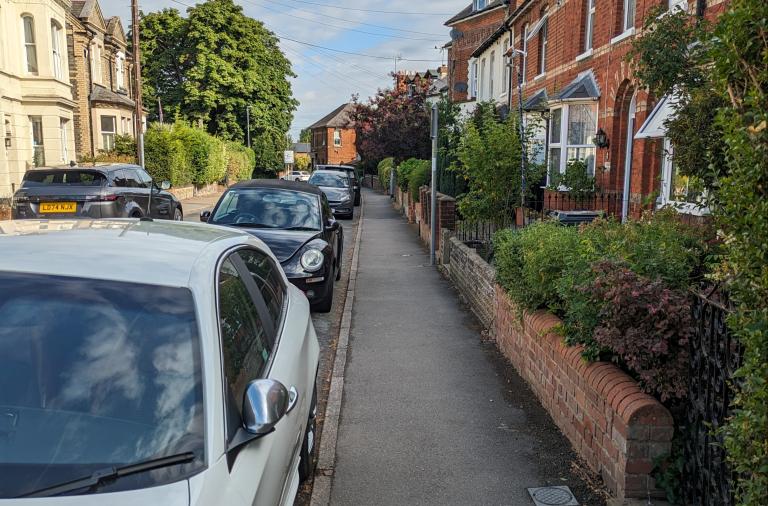 Cars parked on a residential street in Wokingham Borough