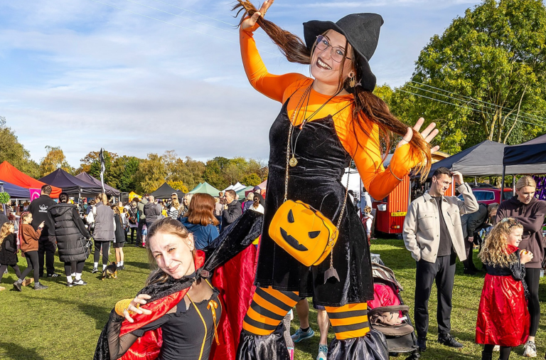 Witch on stilts at the pumpkin fair