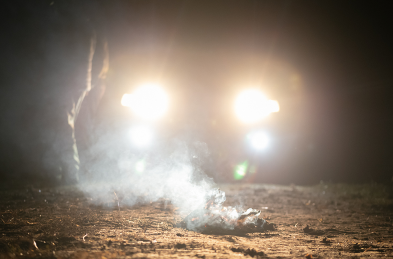 General view of bright car headlights in dark