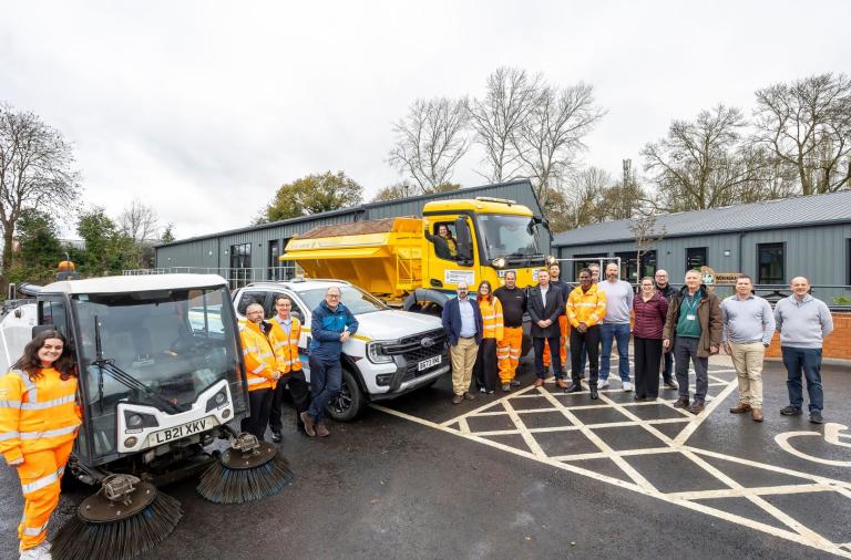 Depot staff and vehicles including gritter and road sweeper outside Toutley Depot.