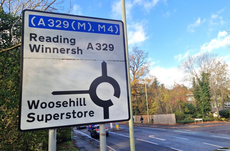 Big roadside sign showing the approach to Woosehill roundabout, with Reading and Winnersh ahead and Woosehill and superstore at first exit
