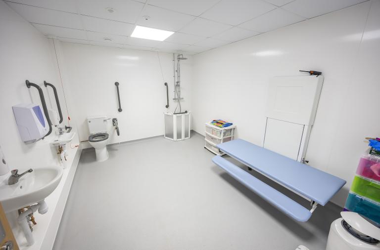 A view of the new bathroom at The Lilypad which includes a changing table, wc, sink and shower
