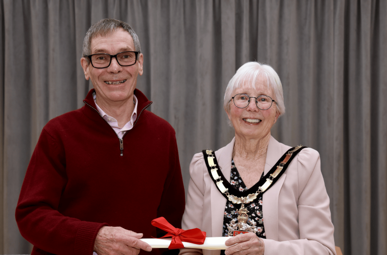 Bob Collis collecting his Mayor's Honour Award