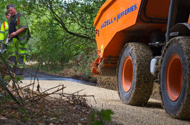 The top stone layer is added to the Ashenbury Park paths