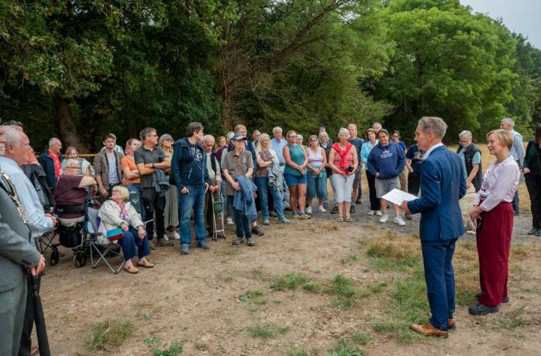 People gathered at the Covid Memorial Woodland during the official opening event near California Country Park.