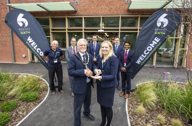 Wokingham Borough Mayor with Bohunt Wokingham headteacher and people handing the keys