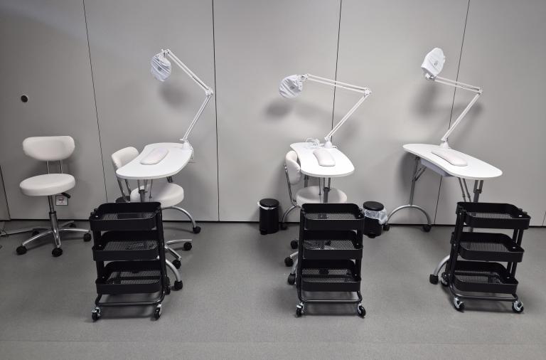 A series of three nail lamps, tables and stools