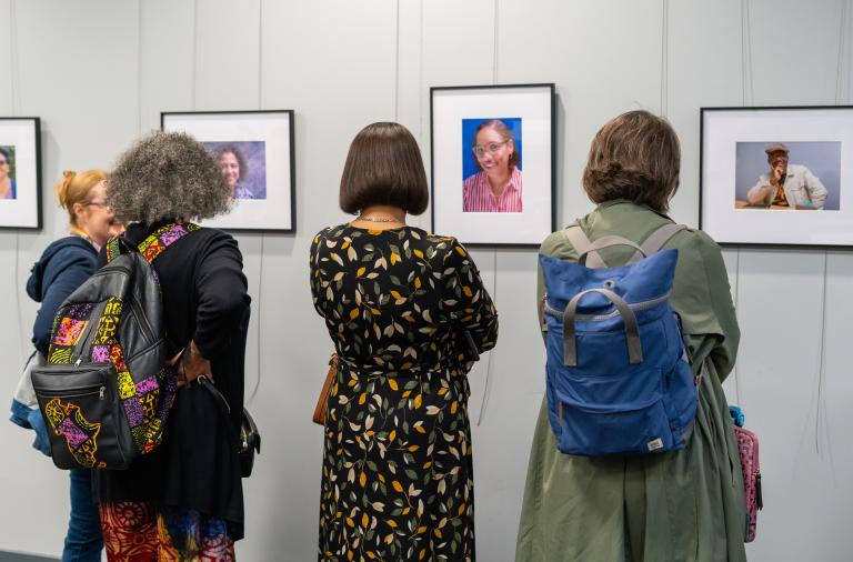 People looking at portraits