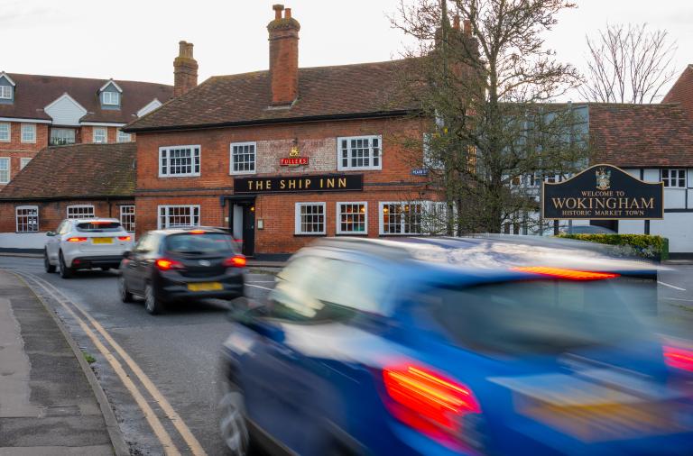 general view wokingham town traffic cars driving