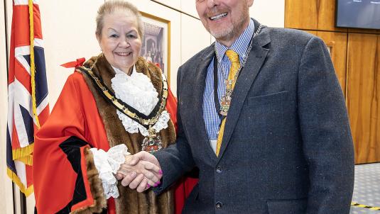 New Wokingham Borough Mayor Cllr Beth Rowland shakes hands with new Deputy Mayor Cllr Adrian Mather