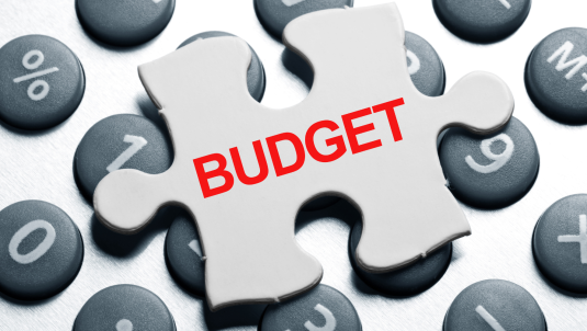 Piece of a puzzle which says 'budget'