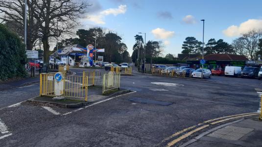 A view of California Cross junction, showing the double roundabouts and Cresswells Garage and Bobs Fish and Chips