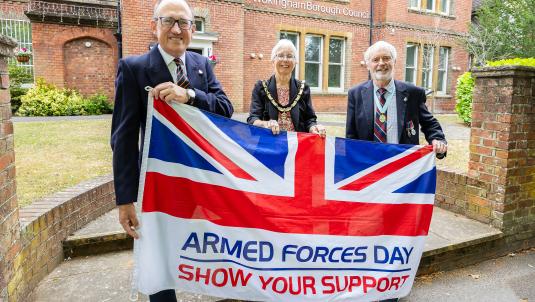 Armed Forces Day 2025 flag raising ceremony. [L-r] Cllr Adrian Betteridge, Wokingham Borough Mayor, Cllr Carol Jewell, and Honorary Alderman Angus Ross