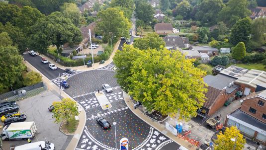 Aerial view of the new California Crossroads junction with level surface and multi-coloured leaf patterns painted on the carriageway