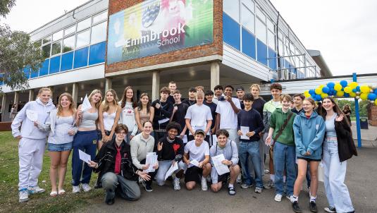 GCSE students with their results outside The Emmbrook School