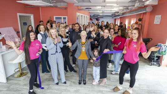 Borough Mayor Cllr Carol Jewell cuts a ribbon with My Little Boardroom staff and visitors