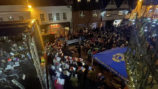 photo of the Wokingham Winter Carnival taken from an upstairs window, with crowds gathered in the town centre