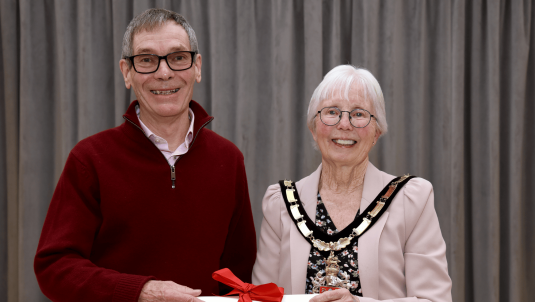 Bob Collis collecting his Mayor's Honour Award