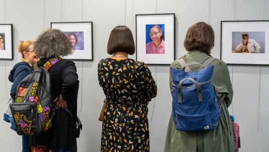 People looking at portraits