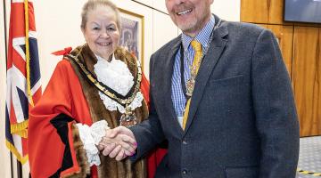 New Wokingham Borough Mayor Cllr Beth Rowland shakes hands with new Deputy Mayor Cllr Adrian Mather