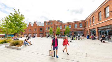 Two children walking through Peach Place in Wokingham